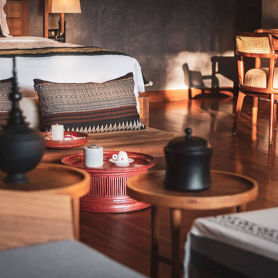 Quiet bedroom interior with warm wood furniture and crafted details